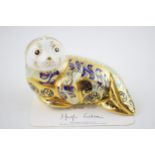 Royal Crown Derby paperweight of a limited edition Harbour Seal, with certifcate and gold stopper.