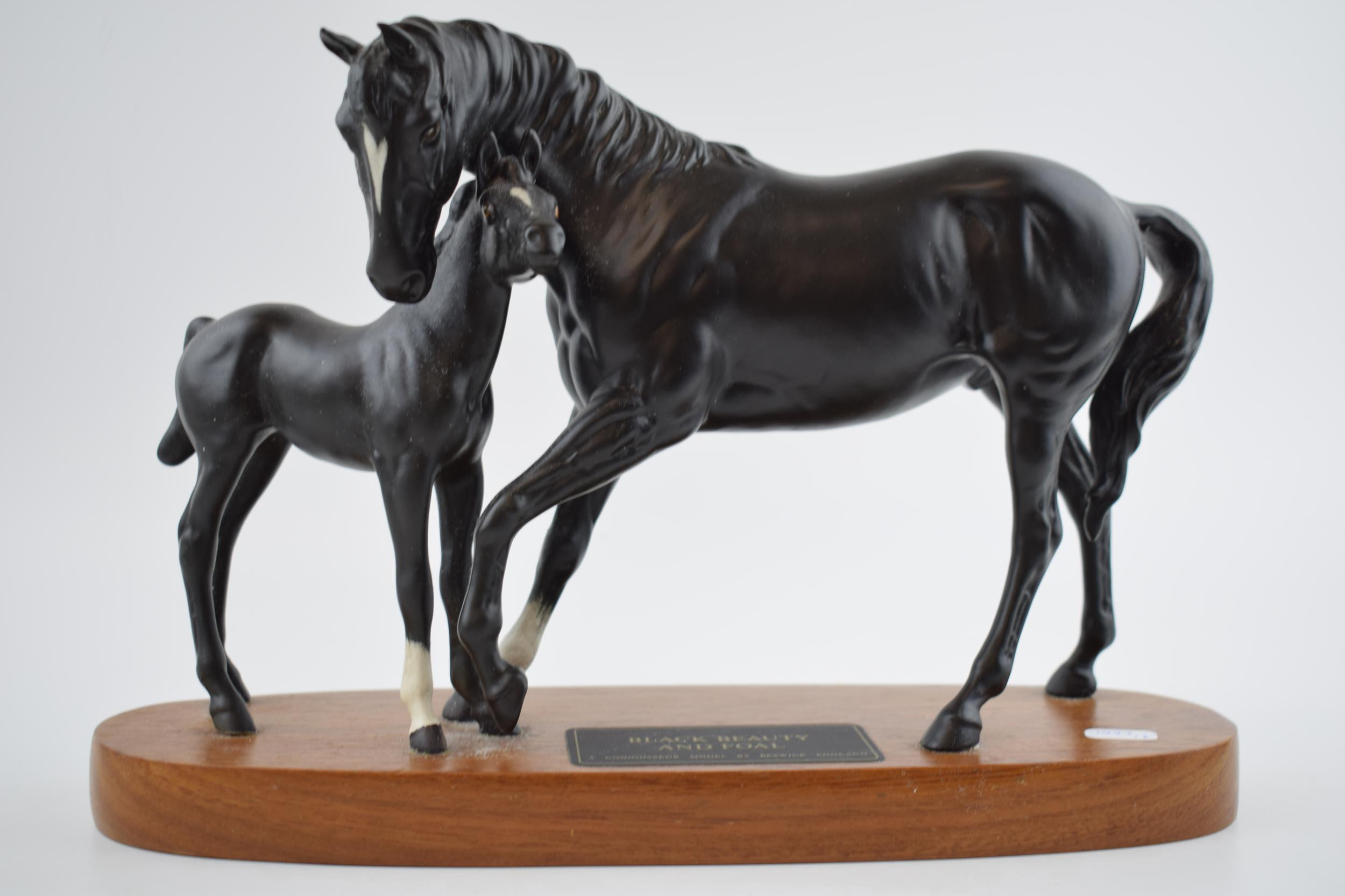 Beswick Black Beauty and Foal on wooden base. In good condition with no obvious damage or