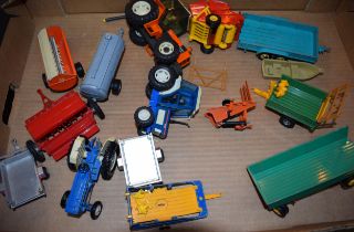 A collection of vintage Britains farm toys to include tractors Ford 2120, Renault 145-14, Ford