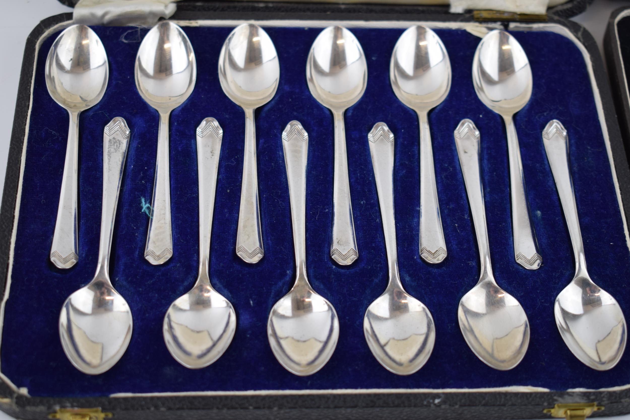 Boxed silver teaspoons together with a set of cake forks with Art Deco style handles, fully - Image 2 of 4
