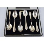 A set of silver spoons hallmarked Sheffield 1945. In original retailers box, T.S Nedham & Murphy,