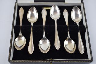 A set of silver spoons hallmarked Sheffield 1945. In original retailers box, T.S Nedham & Murphy,
