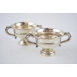 A pair of silver two handled cups / table salts, Sheffield 1929 and 1935, 148.9 grams.