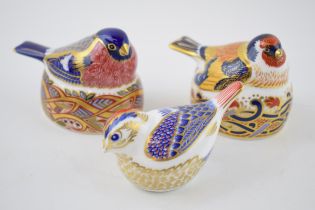 Three Royal Crown Derby bird paperweights, Bullfinch Nesting and Goldfinch Nesting, both 6.7cm high,