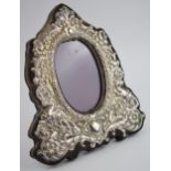 Hallmarked silver ornate photo frame with easel-back, with oval insert, 22.5cm tall, indistinct