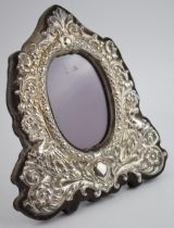 Hallmarked silver ornate photo frame with easel-back, with oval insert, 22.5cm tall, indistinct