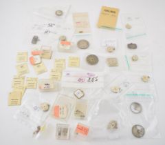 A collection of Longines watch movements and parts. To include rotors, stems, with some NOS parts