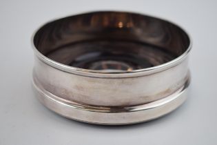 Silver wine coaster with hardwood base. Sheffield 1998. Gross weight 168.5 grams.