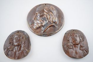 Three salt glazed plaques to include two of Jesus wearing a crown of thorns and one of a gentleman