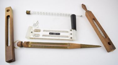 A collection of thermometers to include a flaoting dairy example, a Casella of London whirling