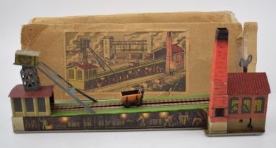Boxed 591 Arnold coal mine clockwork tin toy. Made in Germany. Detailed tin-printed with coal wagon.