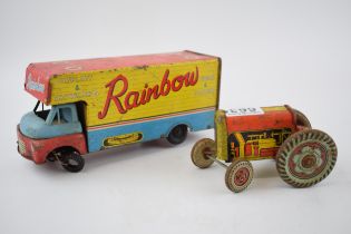 Mettoy tinplate model of a tractor, with blue wheels and a red body, with a vintage tin plate '