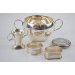 A collection of fully hallmarked sterling silver items to include napkin rings, two handled bowl (