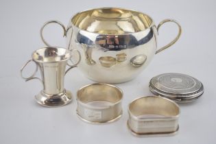 A collection of fully hallmarked sterling silver items to include napkin rings, two handled bowl (