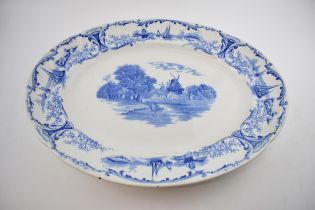A large blue and white 19th century ironstone charger by Stoke Pottery 'Delph' range. Depicting