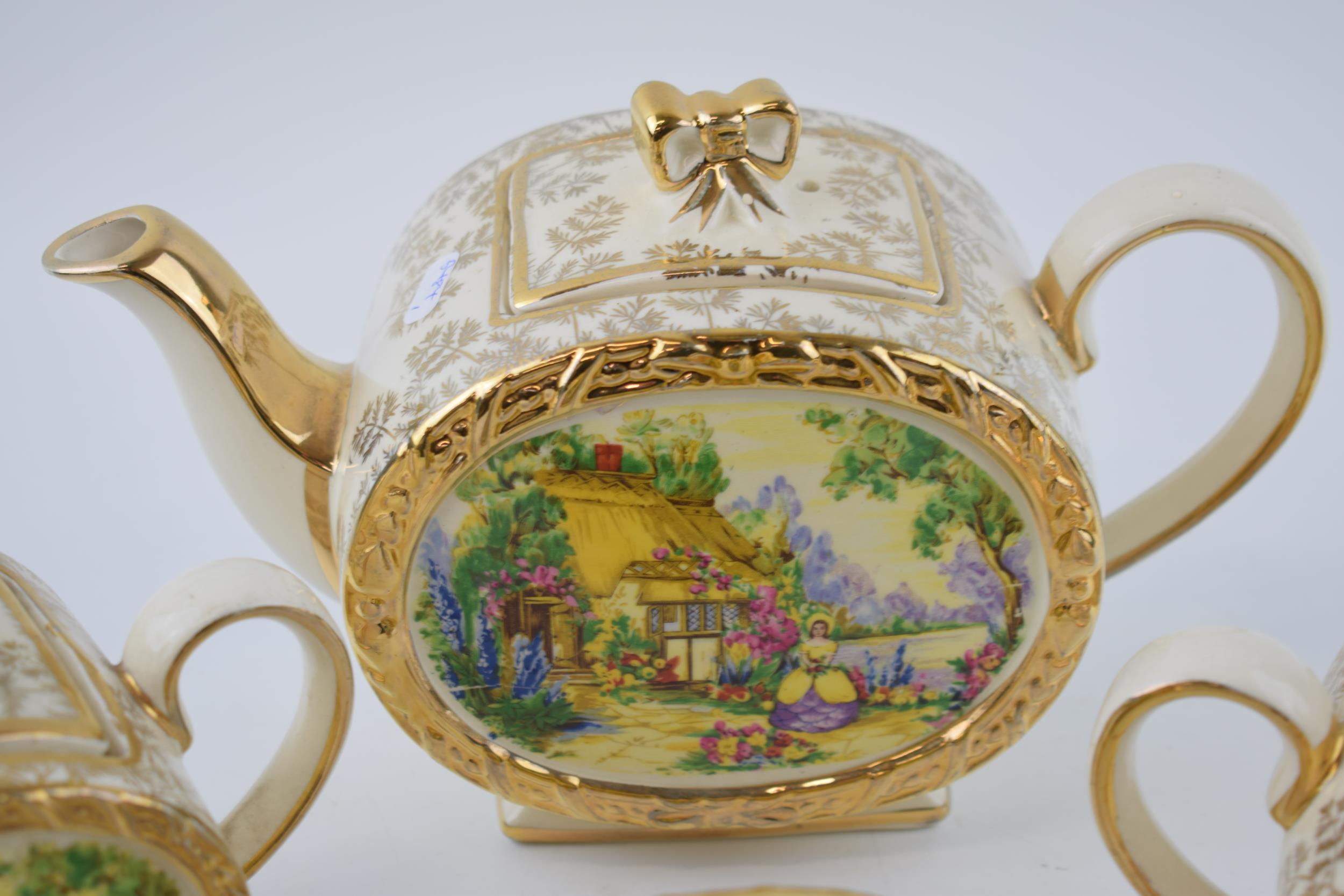 Sadler tea ware in a floral gilt pattern with a cottage scene to include a teapot, 2 lidded sugars - Image 3 of 4