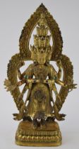 Large reproduction Tibetan gilt bronze figure of a Beddhua, with inset jewel-style decoration,