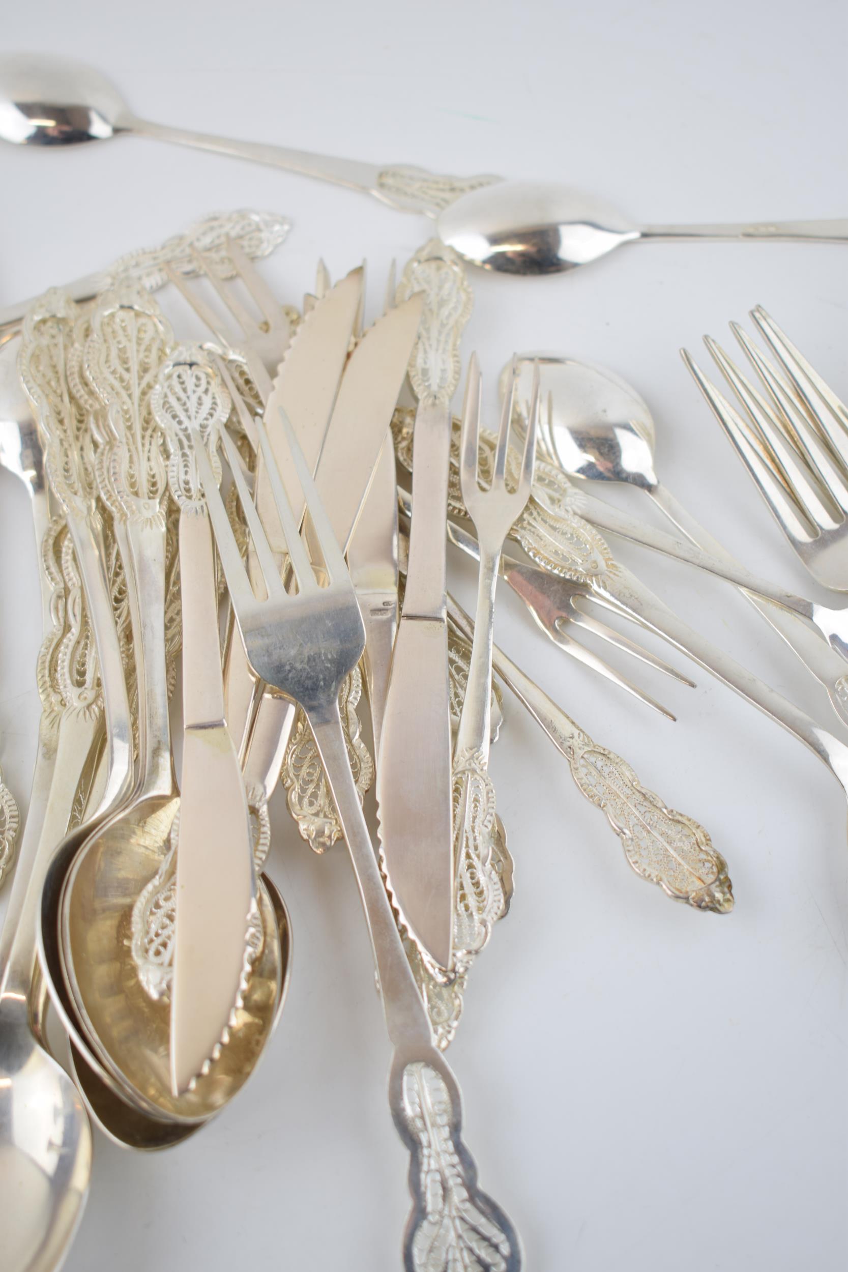 A good collection of silver 830 cutlery with an ornate filigree design, hallmarked 830 with - Image 5 of 8