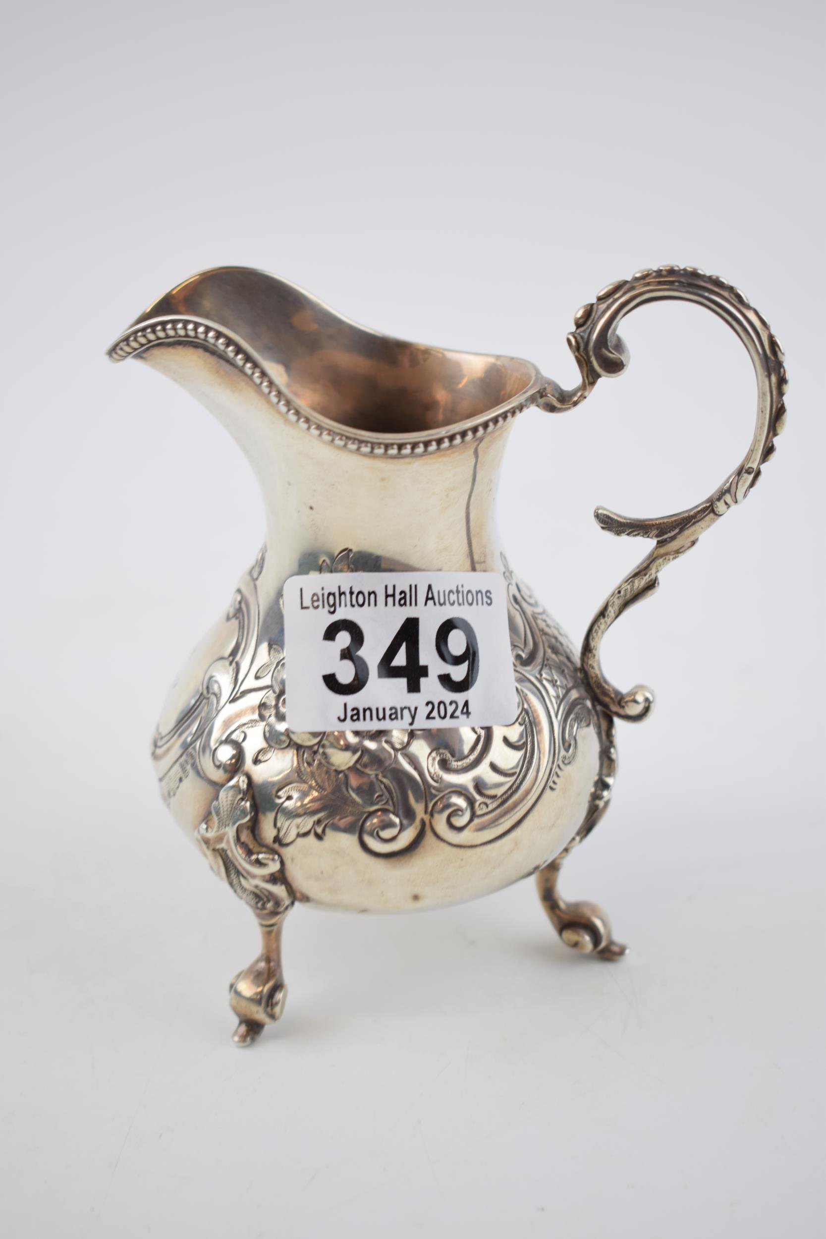 Victorian silver jug with embossed decoration, 169.4 grams, London 1861, 13cm tall. - Image 2 of 3