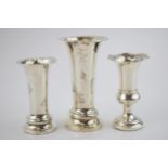 Three sterling silver posy vases with loaded bases of varying sizes. Height 11.5cm and 9.5cm. c1940s