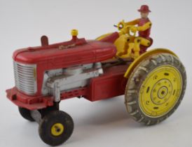 Vintage Louis Marx Farm Tractor and driver. Plastic & Tin Toy. 17cm x 25cm. In play worn condition.