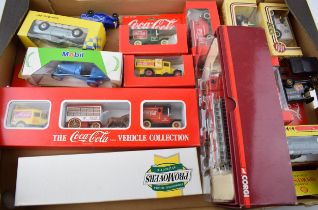 A collection of boxed die cast model cars and trucks to include Coco Cola vehicle collection,