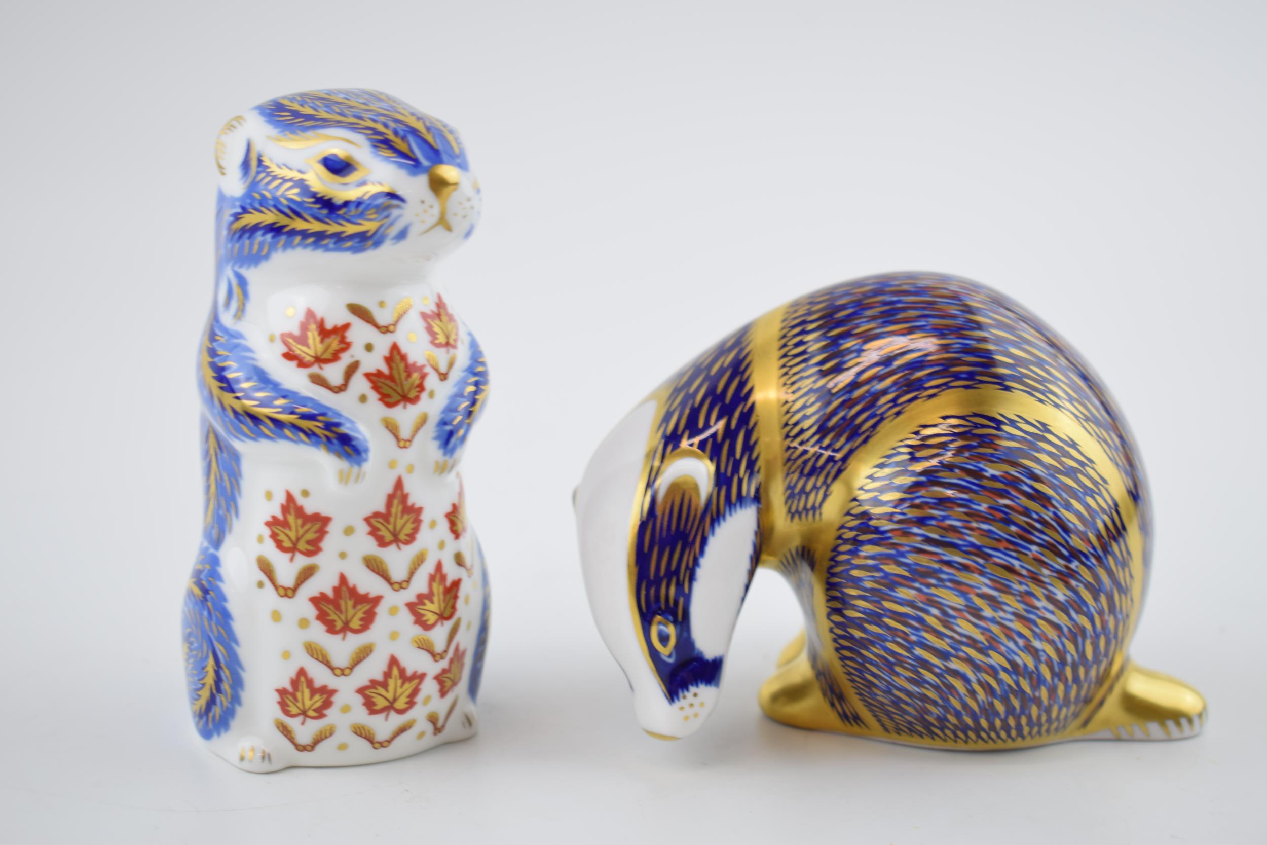 Royal Crown Derby paperweights to include a badger and a chipmunk, both with gold stoppers (2). In