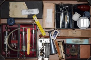 A collection of antique medical items to include cased equipment and boxed slides. (large tray) In