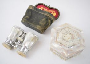 A pair of Negretti & Zambra of Regent Street London opera glasses in mother of pearl together with a