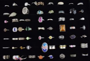 A large collection of silver rings to include varying styles, sizes, gemstones and periods, (60