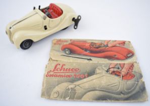 Boxed Schuco Examico 4001 tin toy clockwork car. With four working gears and reverse. Original