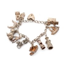 Silver charm bracelet with charms to include an Airedale terrier, a bulldog, a galleon and others,