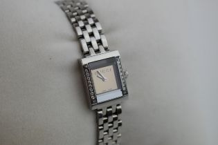 A ladies Gucci fashion watch with Swiss quartz movement. Black rectangular dial with applied baton