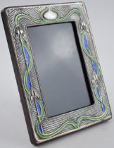 Sterling silver fronted photo frame with enamelled decoration in the Art Nouveau style, 19.5cm tall.