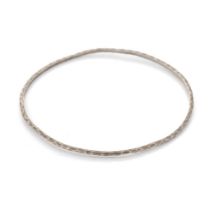 Tiffany & Co hammered silver bangle, with original purchase receipt, 5.0 grams. In good condition, a