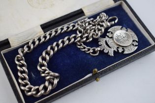 Antique silver graduated albert chain, hallmarked on every link. With silver fob engraved E C