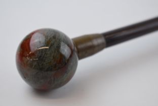 19th century walking cane with moss agate orb handle, brass mount and original brass ferrel.