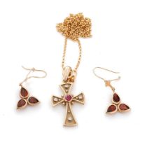 A 9ct yellow gold cross pendant marked .375 set with a ruby and four diamonds, on a 9ct gold chain