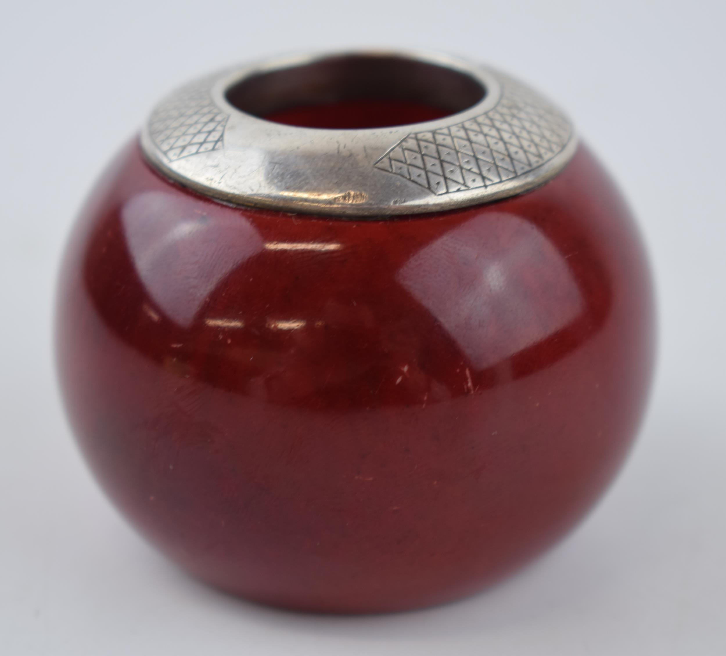 Royal Doulton flambe match holder and striker, London 1907, 6.5cm diameter. Good condition,