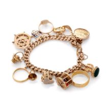 9ct rose gold charm bracelet with an interesting collection of charms to include a 22ct gold 1912