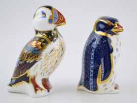 A Royal Crown Derby paperweight, Puffin, date code for 1996 (LIX) and Rockhopper Penguin, 21st