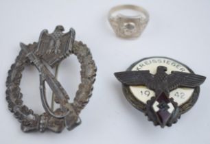 A collection of German military items to include a ring with skull and crossbones marked D.G.R.M and