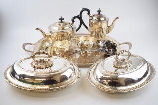 Silver plate to include a pair of entree dishes, a 4 piece teaset, a large tray and others.