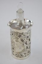 Silver cased glass perfume bottle, Birmingham 1904, A W Pennington, 14.5cm tall. In good condition