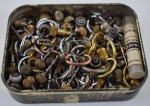 A quantity of pocket watch crowns, stems and bows of various sizes. Some gold parts noted