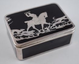 A black ceramic trinket box with inlaid decoration of a hunting scene, with huntsman and