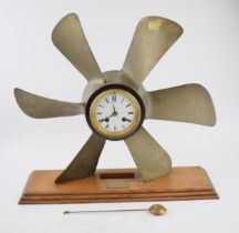 Phosphor bronze propellor with pendulum chiming clock. White ceramic dial with Roman numerals and