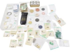 A good collection of Rolex watch parts and similar to include dials, movement parts, balances,