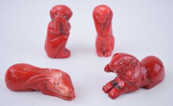 A collection of four oriental red jasper zodiac figures to include a rabbit a ram and two monkeys.