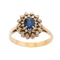 14ct yellow gold sapphire and diamond cluster ring marked .585 to shank. Center oval Ceylon